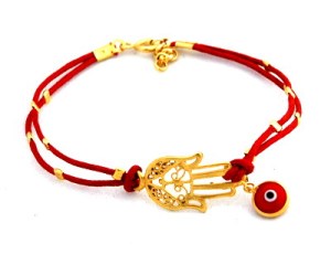 All the girls in the village are wearing these North African/ Middle Eastern charms against the evil eye nowadays! I had a fascinated group of them around me last night hearing me explain what the latest trend really means!